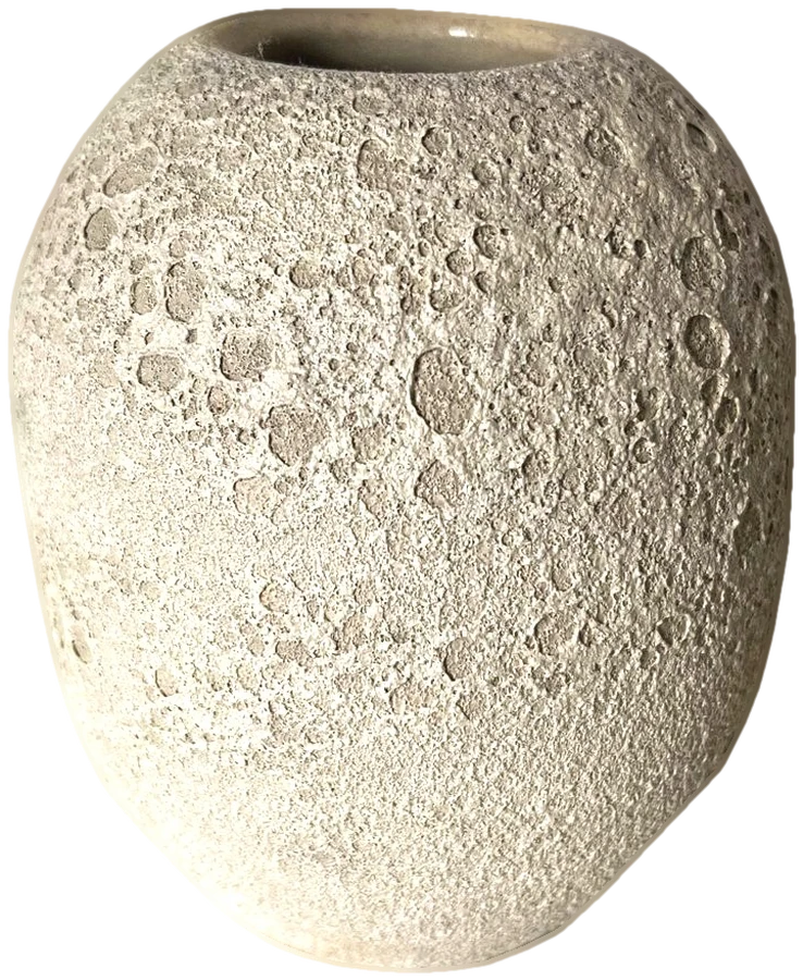 Small pale ceramic vase with a pitted, moon-like crater texture