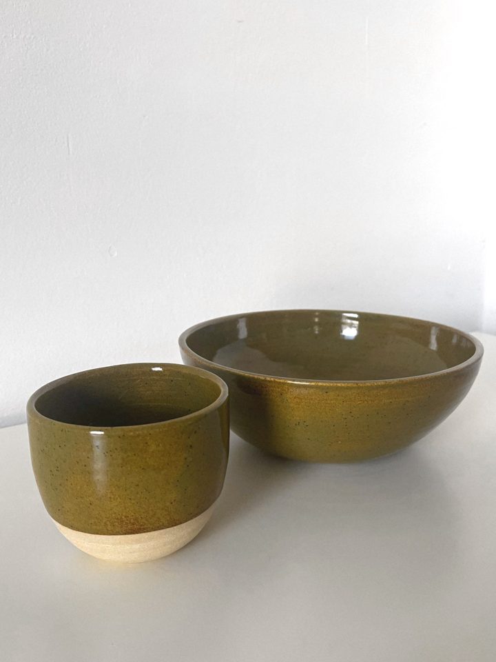 Handmade ceramic cup and bowl set in a speckled olive green glaze
