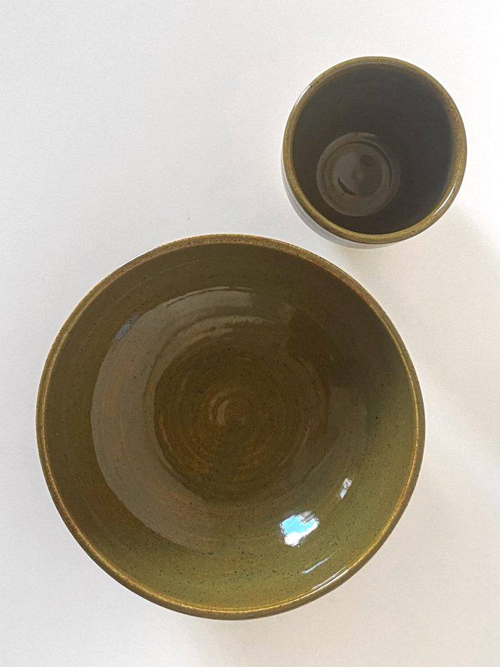 Handmade ceramic cup and bowl set in a speckled olive green glaze, second view